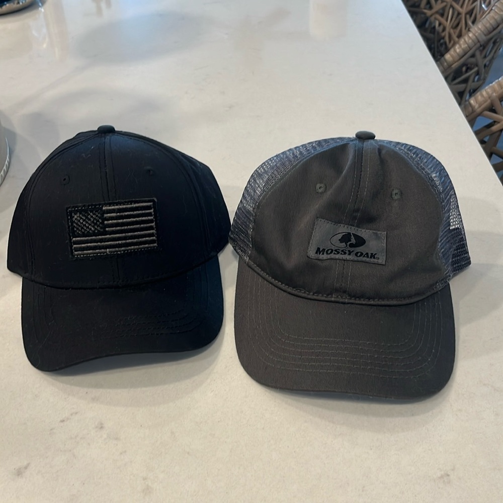 Two Men’s Baseball Hats Mossy Oak and Flag